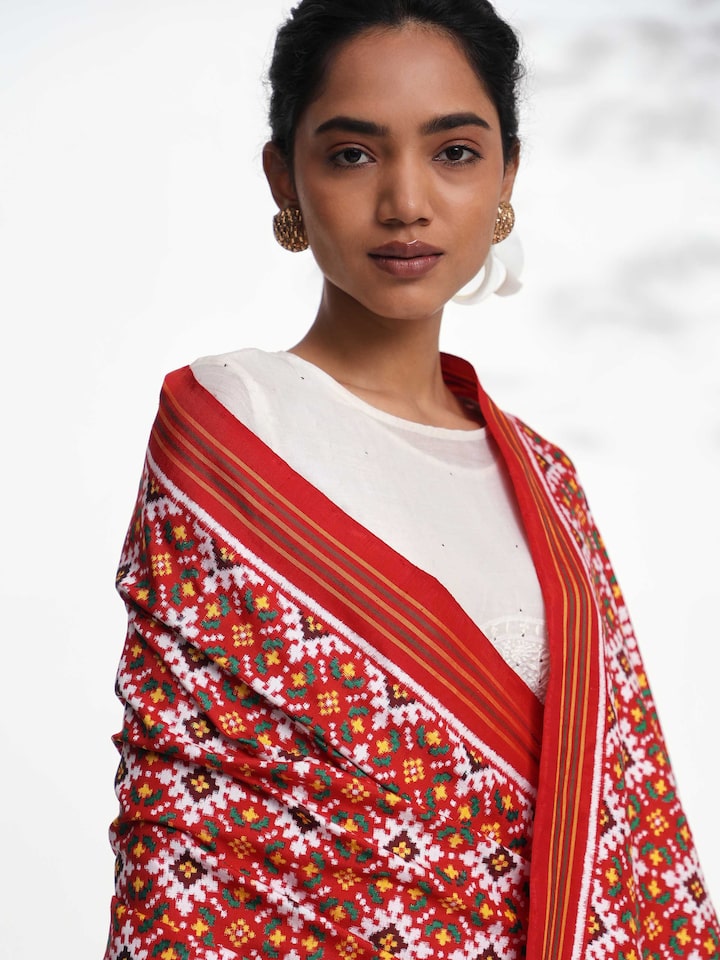 Detailed side view of pink ikat Patan Patola handwoven dupatta showcasing craftsmanship