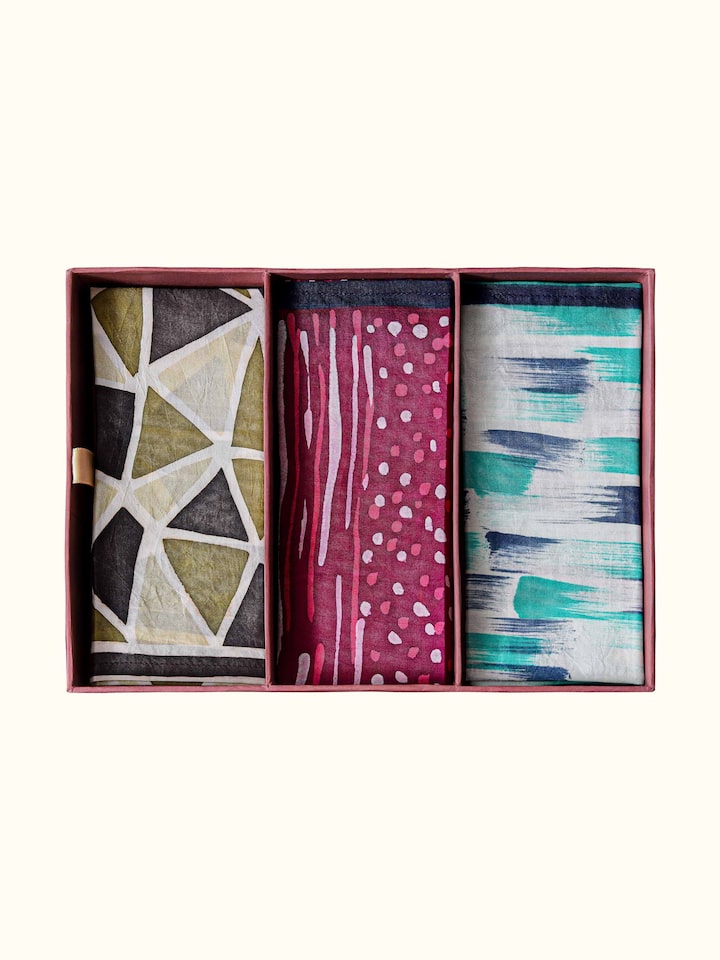 close-up view of assorted silk discharge block printed pocket squares texture