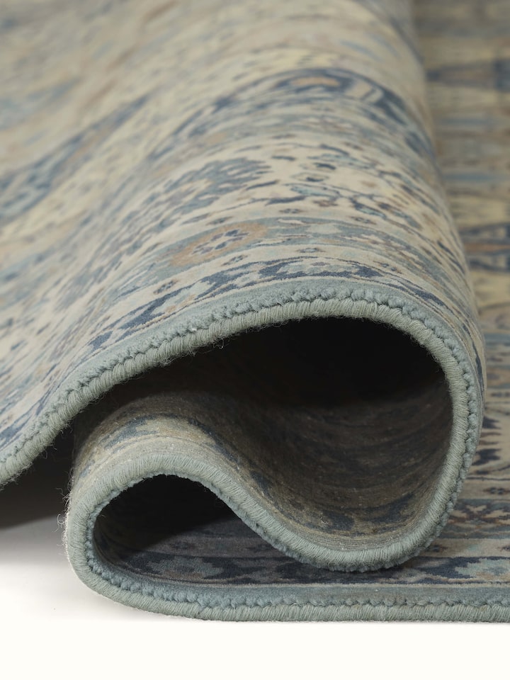 Texture detail showing wool weave and subtle color gradients in Sarouk rug