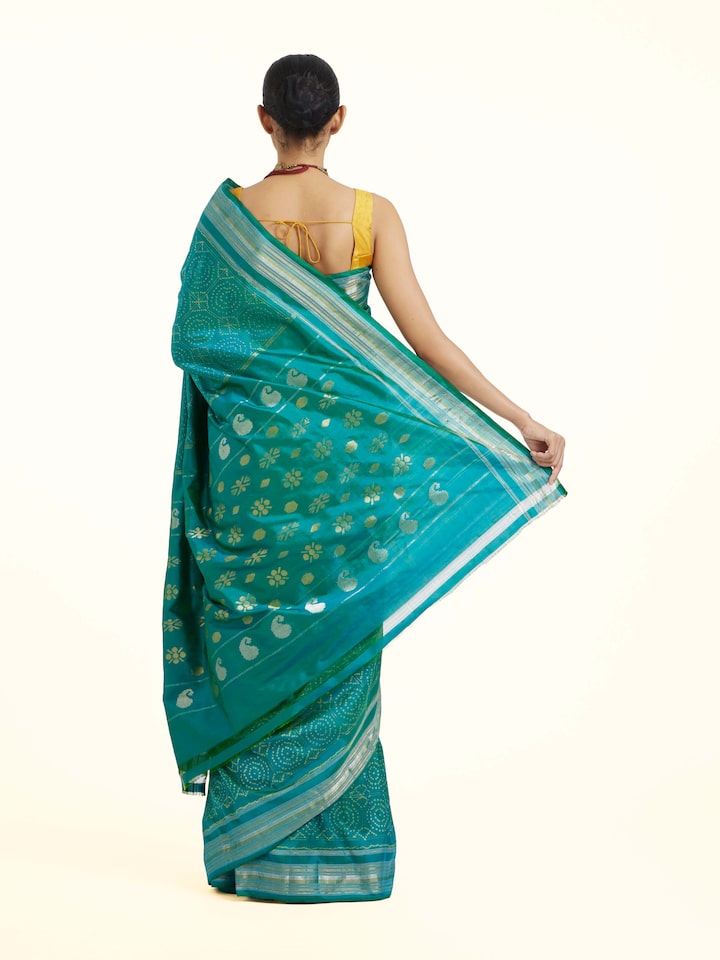 Back view of Turquoise Pochampally Double Ikat Saree emphasizing the overall design and fine details
