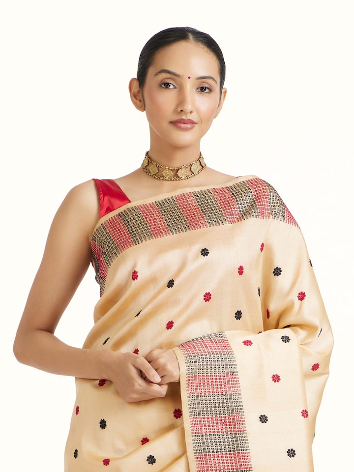Close-up view of Beige Tussar Silk Saree highlighting the handwoven motif and texture