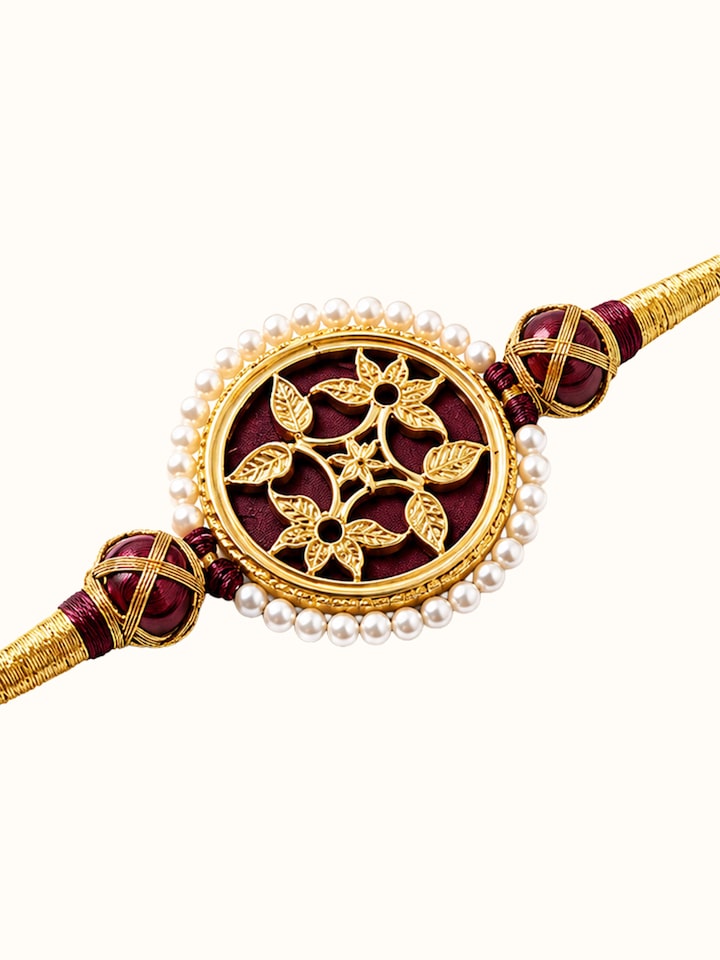Detail view of Thewa Rakhi highlighting the stone setting and metalwork detail