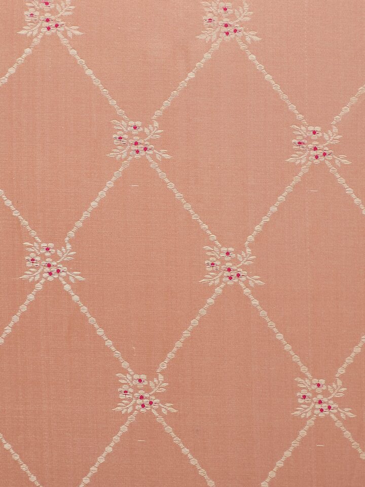 Detail shot of gold zari floral design on Awadh peach Banarasi cushion cover.