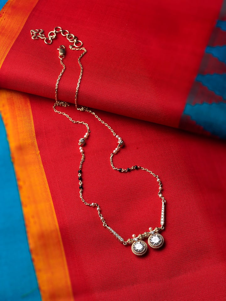 lifestyle view of open setting 14 karat gold mangalsutra