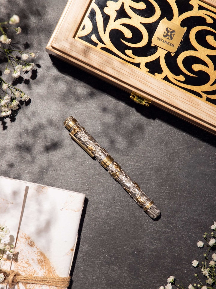 Styled detail view of Silver Smithing Silver Pen held in hand, shown in an alternate styled shot