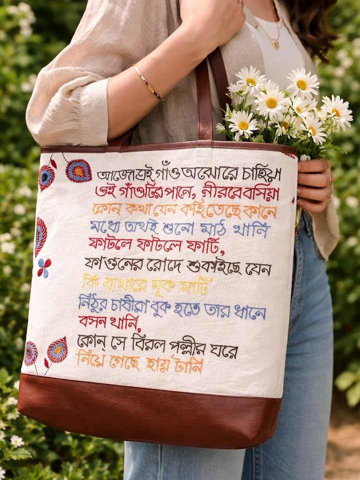 Kantha Embroidered Canvas Tote Bag styled outdoors carried by a model with flowers