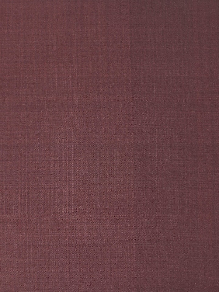 Detailed side view showing fabric texture and fine Ikat weave in deep brown.