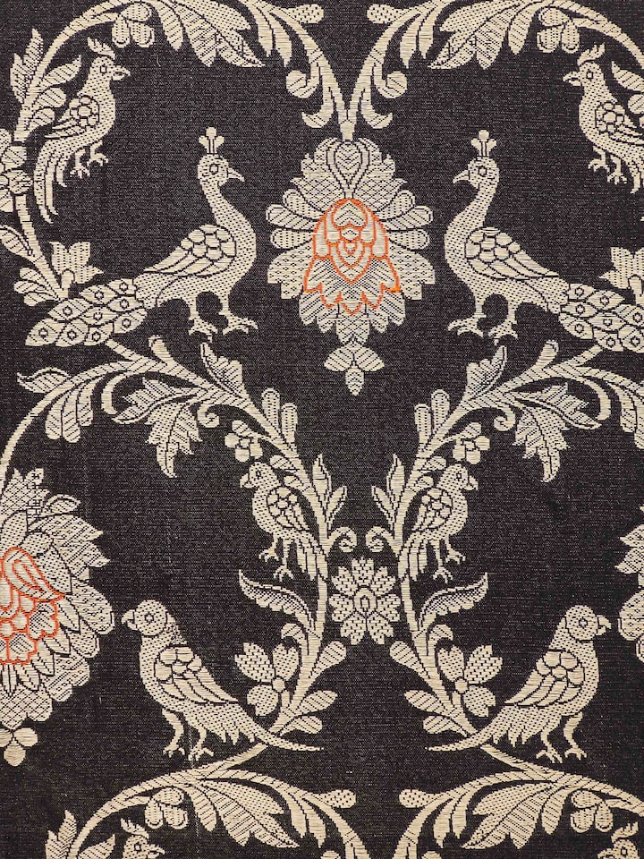 Close-up shot of Banarasi weave detailing on black silk cushion cover