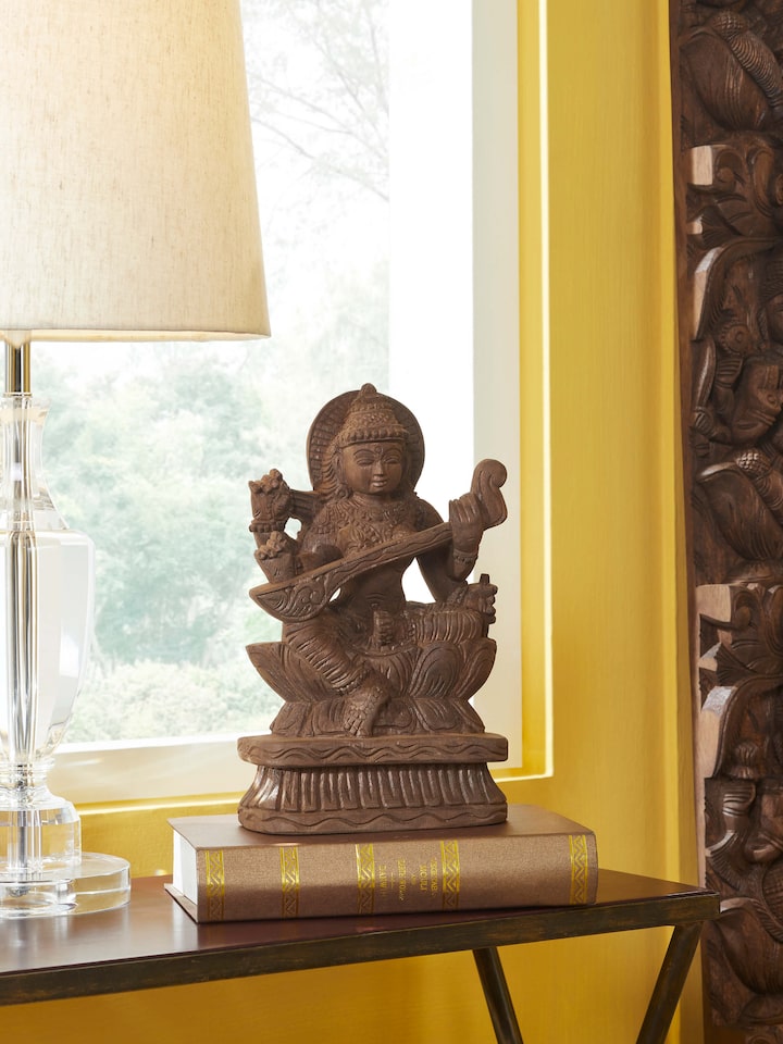 Left-side view of the Wood Carved Saraswati Devi Idol