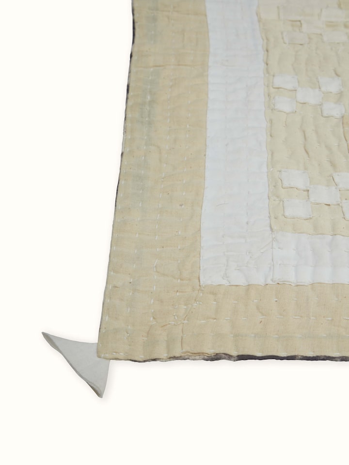 Close-up of abstract patchwork design on Siddi single bedspread