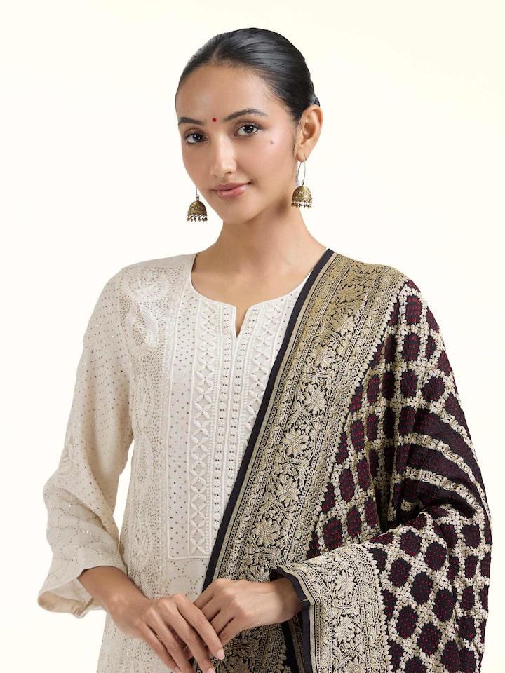 Angled view of Black Bandhani Tie & Dye Silk Dupatta revealing the depth of its color and intricate pattern