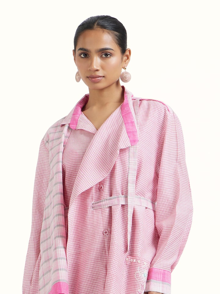 Angled view of Off white Bengal Handloom Dress revealing the depth of its color and intricate pattern