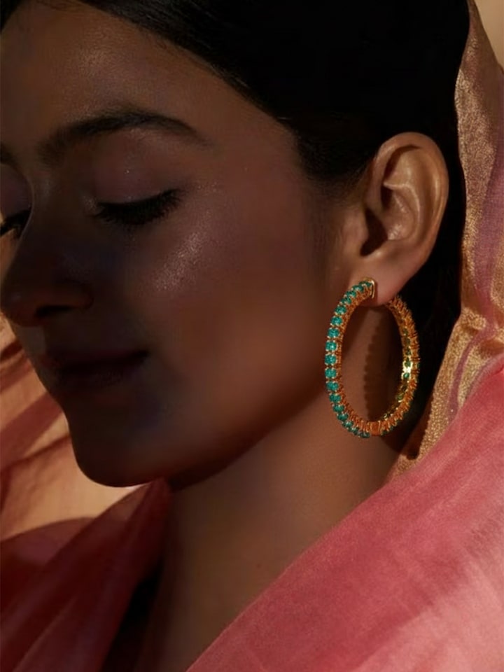 lifestyle view of silver smithing silver hoop earrings