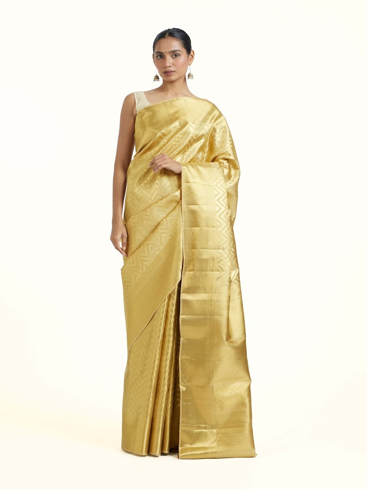 Front view of Gold Kancheepuram Silk Zari Saree showcasing its traditional craftsmanship and design