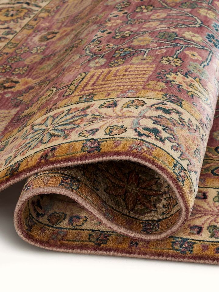 Angled view of Ziegler Traditional Light Majenta Jaipur Wool Hand-Knotted Carpet, displaying the overall design and color.