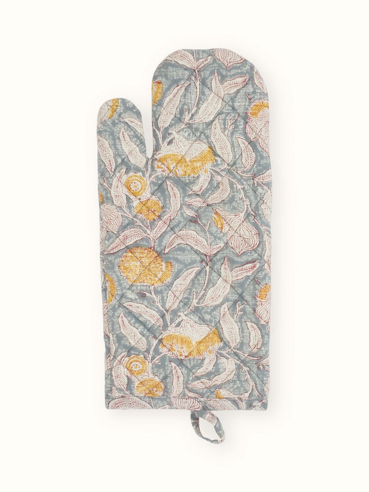 Close-up of Samaha oven mitt with grey floral Sanganeri block print on cotton.