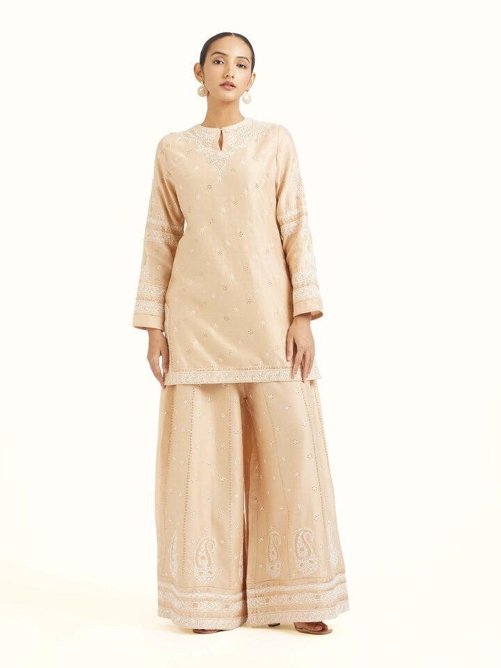 Front view of beige silk chikankari kurta with delicate hand embroidery