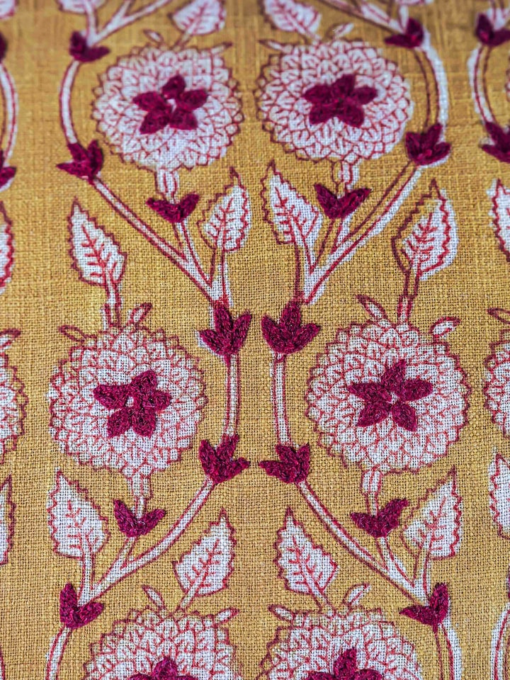 Close-up of the Marigold Hand Block Dabu With Embroidery Floral Lumbar Cushion