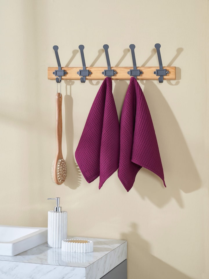 Amala purple waffle cotton hand towels placed in bathroom setting – set of 2