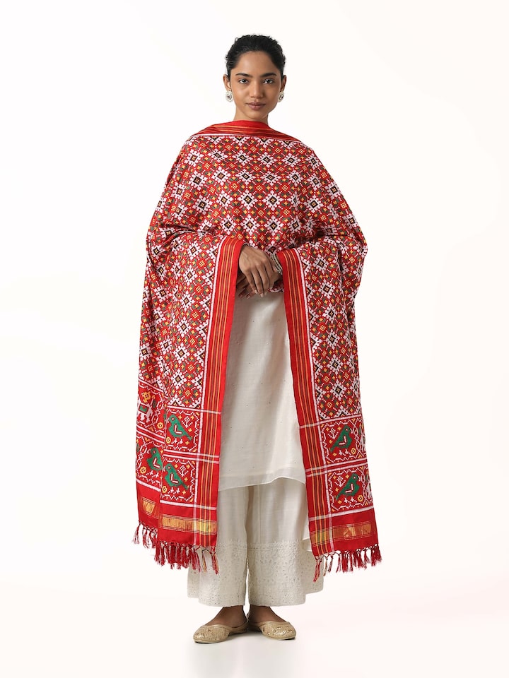 Front view of pink ikat Patan Patola handwoven dupatta showcasing vibrant motifs