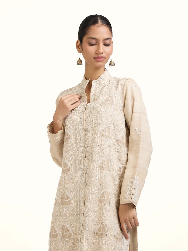 Angled view of the Beige Tussar Silk Chikankari Jacket Style Kurta