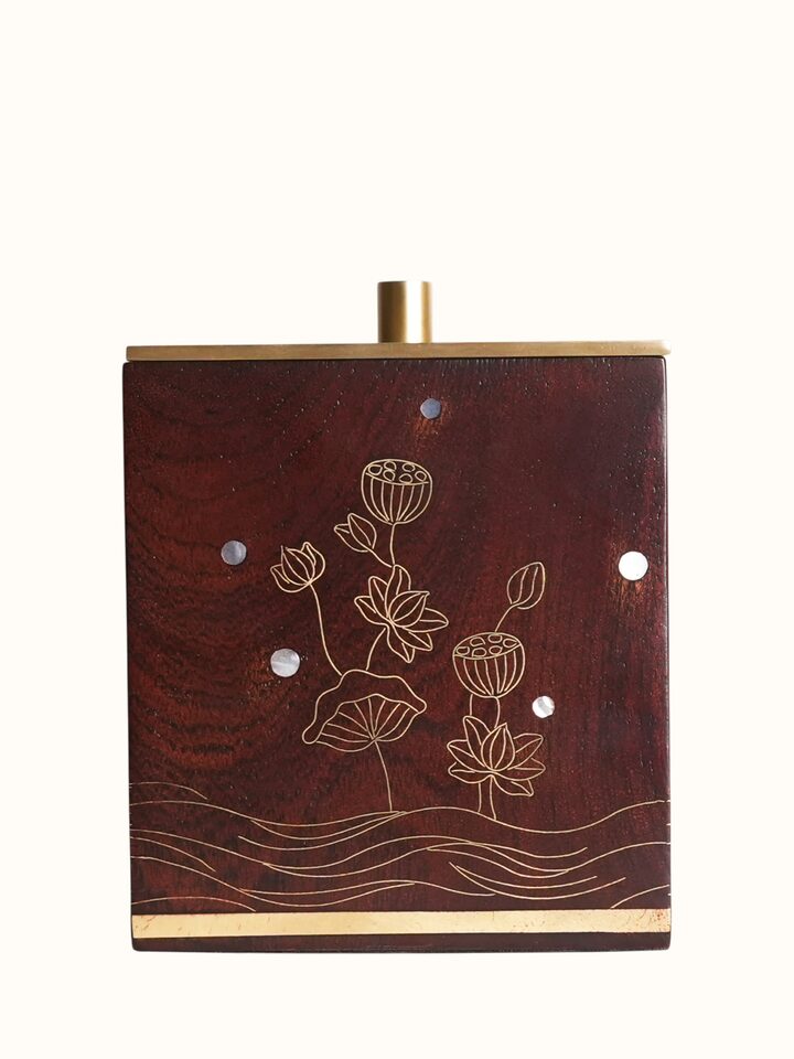 Angled view of the Kamal Tarkashi Teak Wood Cotton Jar