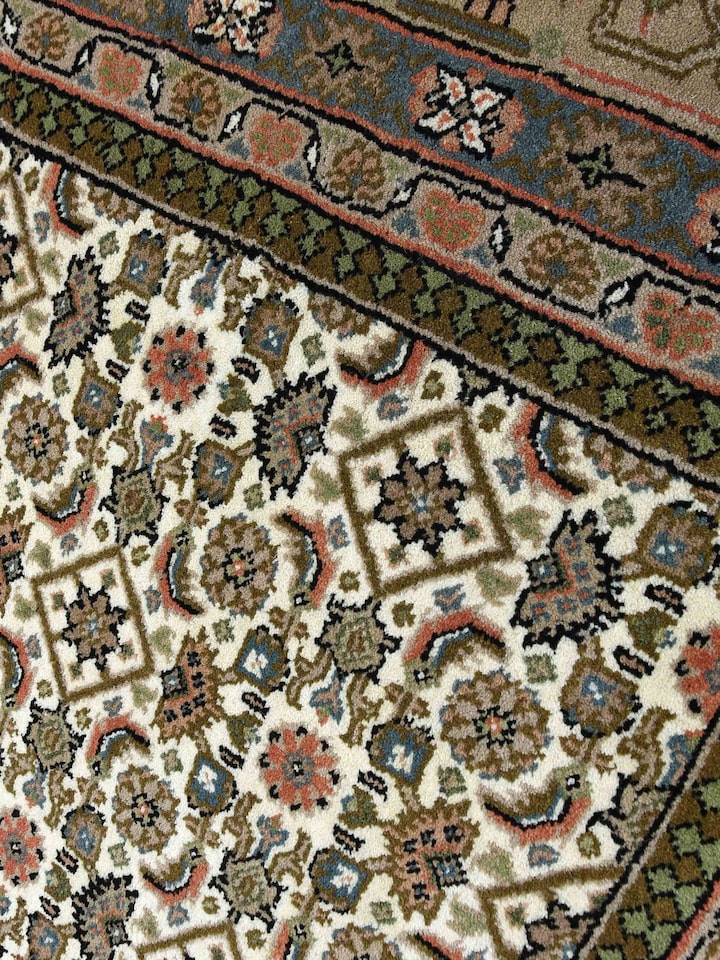 Detail view of Traditional Persian Herati Beige Bhadohi Wool Hand Knotted Rug highlighting the intricate pattern and pile texture, from a different...
