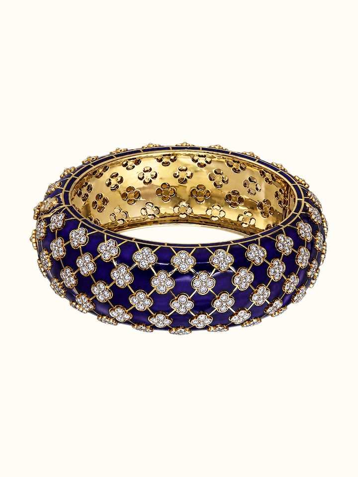 Detail view of Open Setting 14 Karat Yellow Gold Bangle with Diamonds highlighting the stone setting and metalwork detail, from a different angle