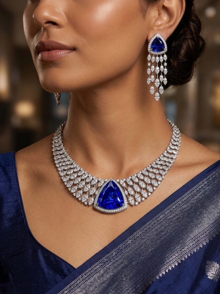 Styled view of Open Setting 14 Karat White Gold Set with Diamonds and Sapphires held in hand, showing how it looks styled