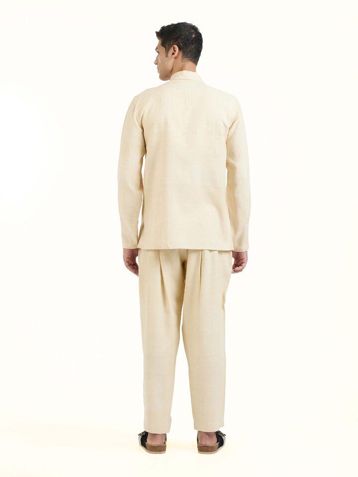 Back view of beige silk handloom jacket displaying complete design
