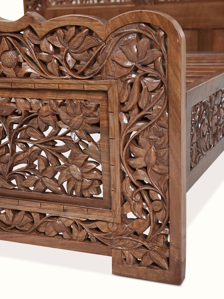 Detail view of Carved Walnut Wood Queen-size Bed highlighting the carved floral vine corner detail