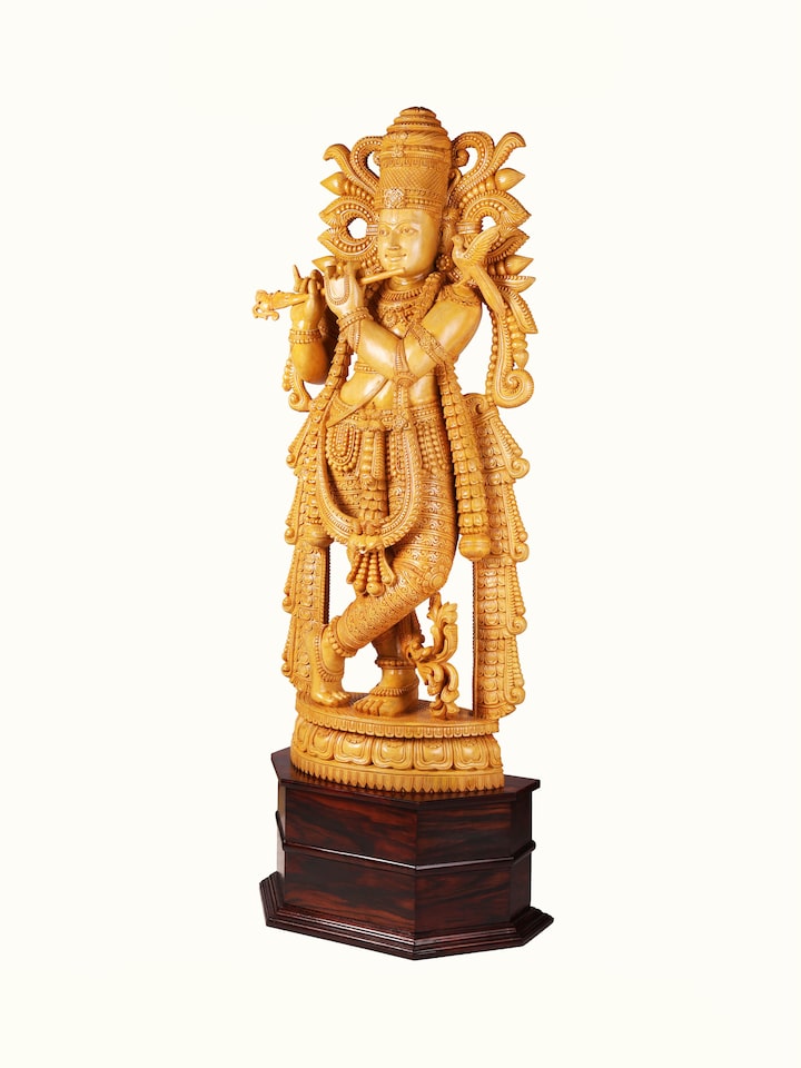 Angled view of the Wood Carved Krishna Idol