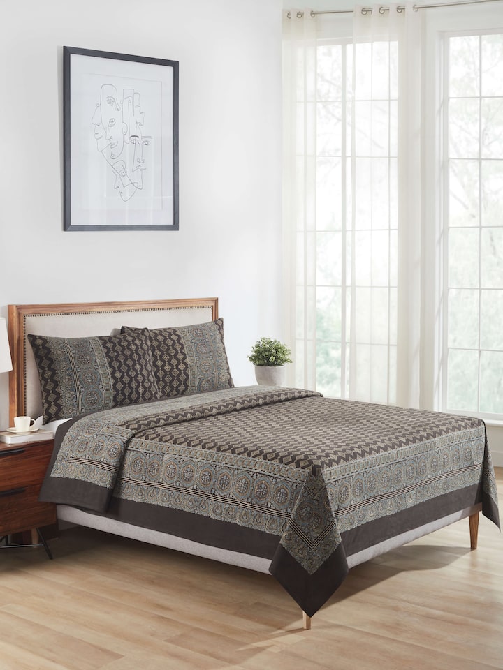 Close-up of Sindh dark brown jaal cotton ajrakh block printed queen bedspread set (3 pcs) focusing on the block print details and fabric texture.
