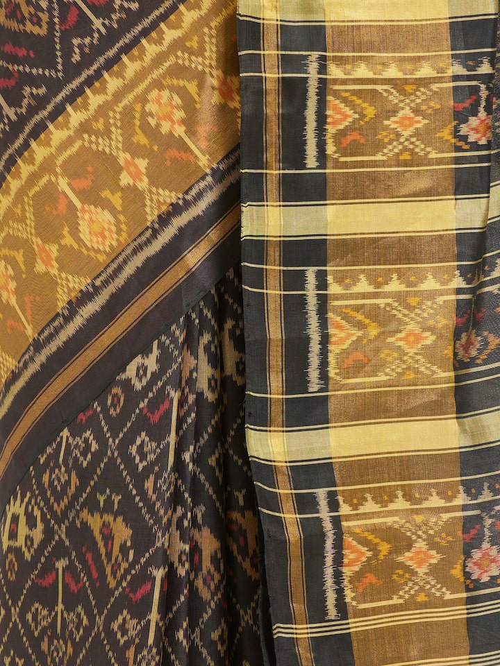 Detailed view of Rajkot Patola Ikat Saree focusing on the fine craftsmanship and texture