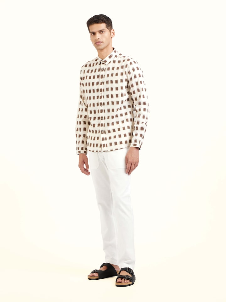 Side view of white cotton Telangana Ikat shirt highlighting tailored fit