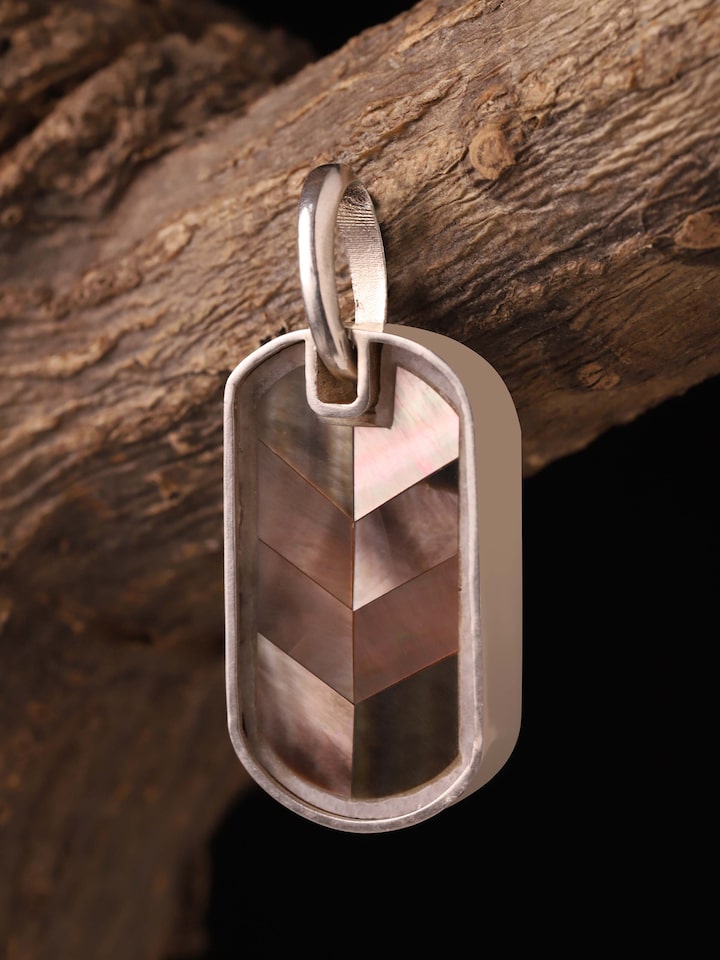 Styled detail view of Kutch Leather Silver Drop Earrings worn on the ear, shown in another styled shot