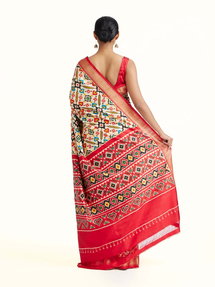 Back view of Cream Double Ikat Silk Saree emphasizing the overall design and fine details