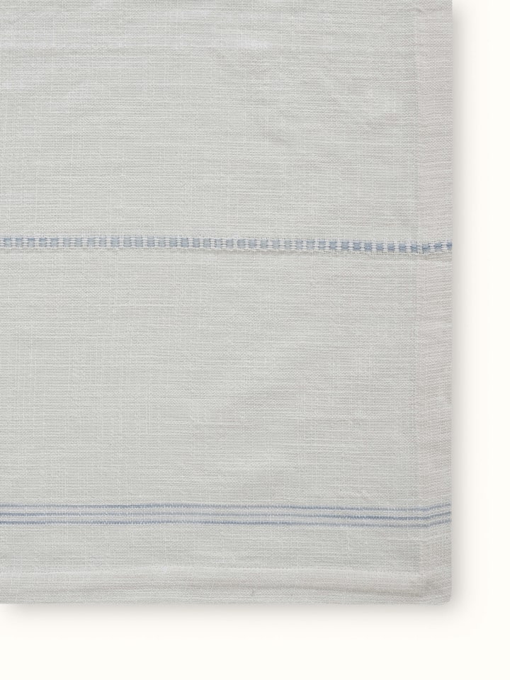 Angled view of Arth Light Blue Stripe Cotton Handloom Table Cover showing textured weave and soft hues