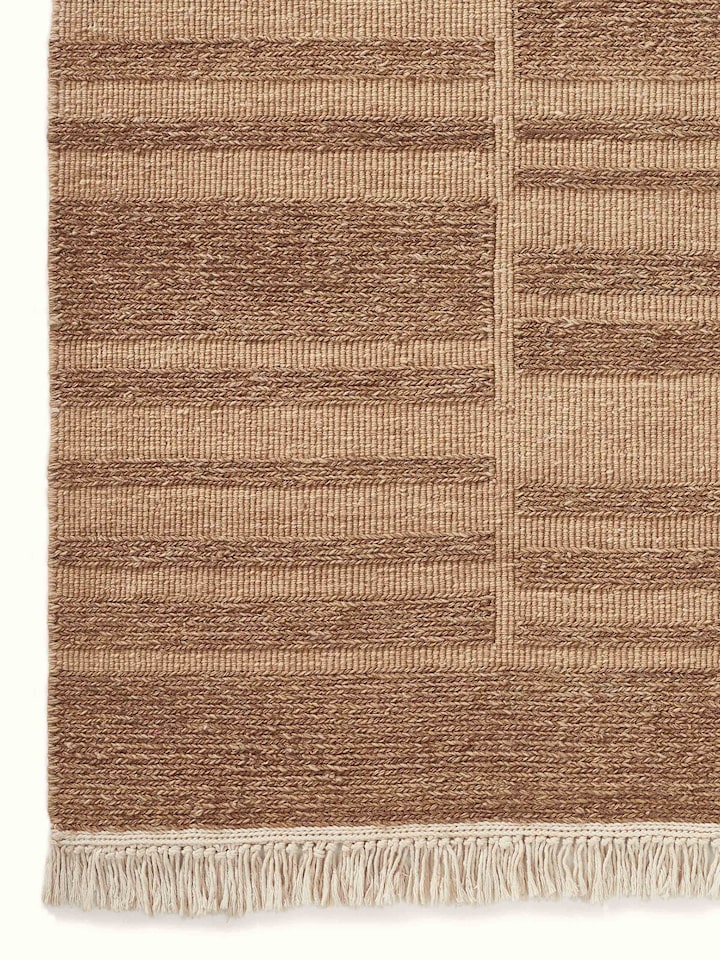 Close-up detail capturing the intricate craftsmanship and texture variations of the wool fibers