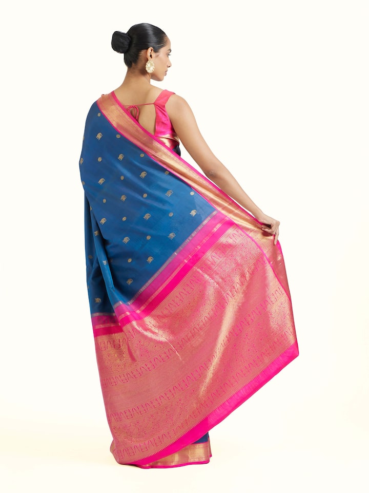 Back view of dark blue silk Kancheepuram saree displaying ornate pallu design