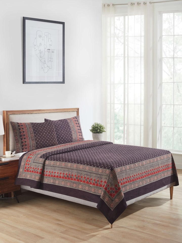 Side view of Sindh multicolour jaal cotton ajrakh block printed queen bedspread set highlighting the fabric's texture and colors