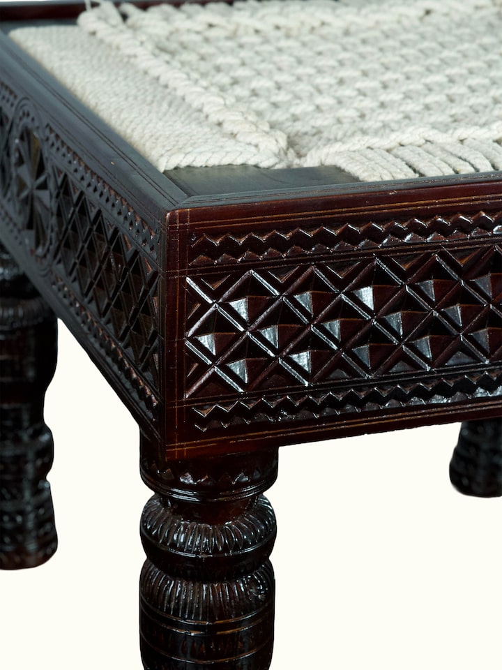 Detail view of the Carved Teak Wood & Glass Stool