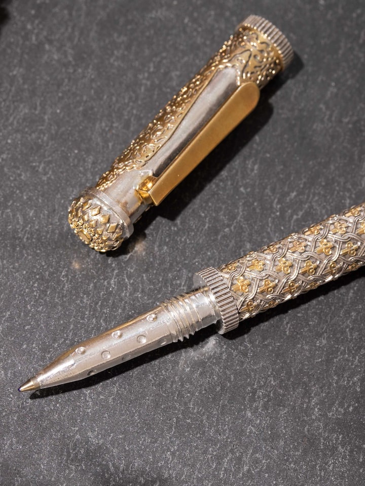 detail view of silver smithing silver pen body