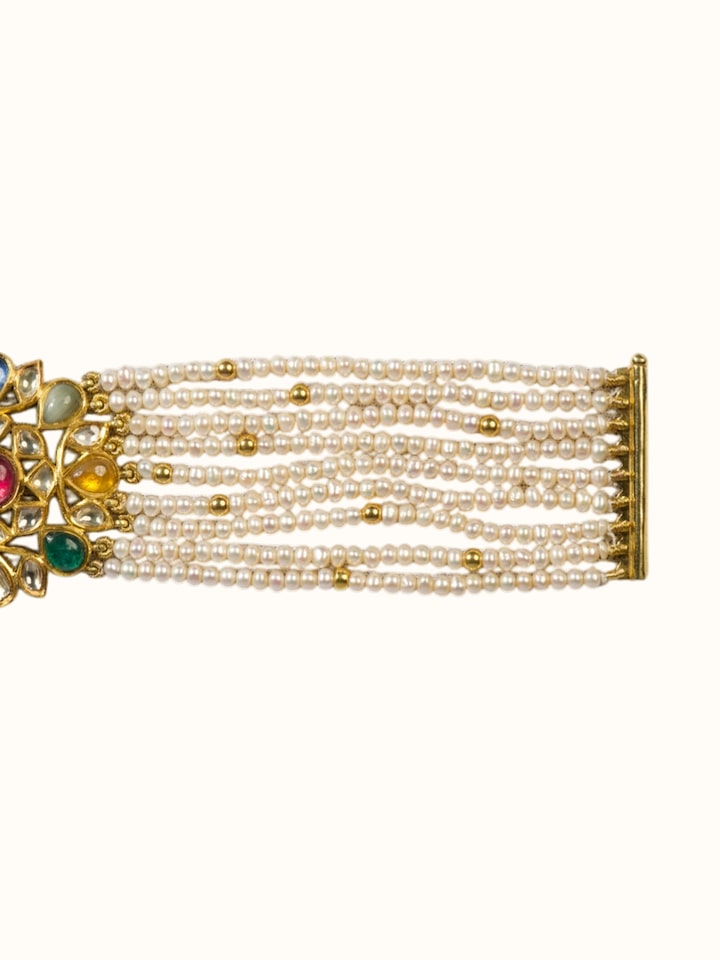 Detailed side view of the Jadau Navaratna 18 Karat Gold Bracelet