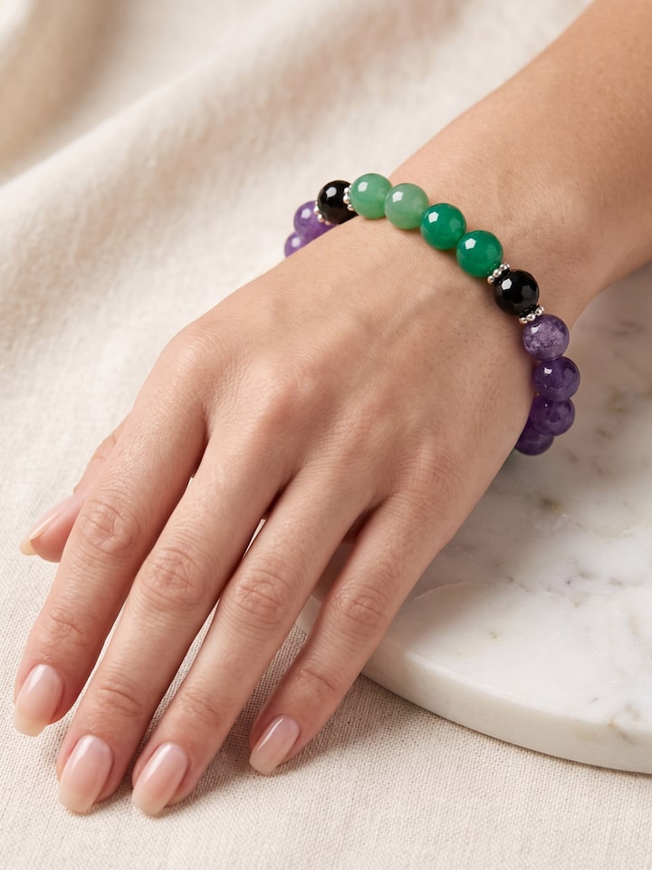 Styled view of Gemstone Garnet, Black Onyx, Amethyst & Green Onyx Silver Bracelet worn on the wrist, showing how it looks styled