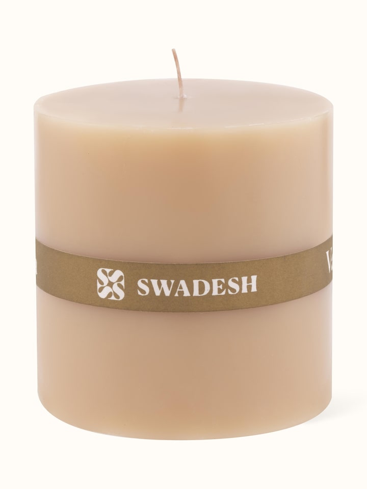 Vanilla pillar candle (3 inches) displayed in a setting to emphasize its decorative use.