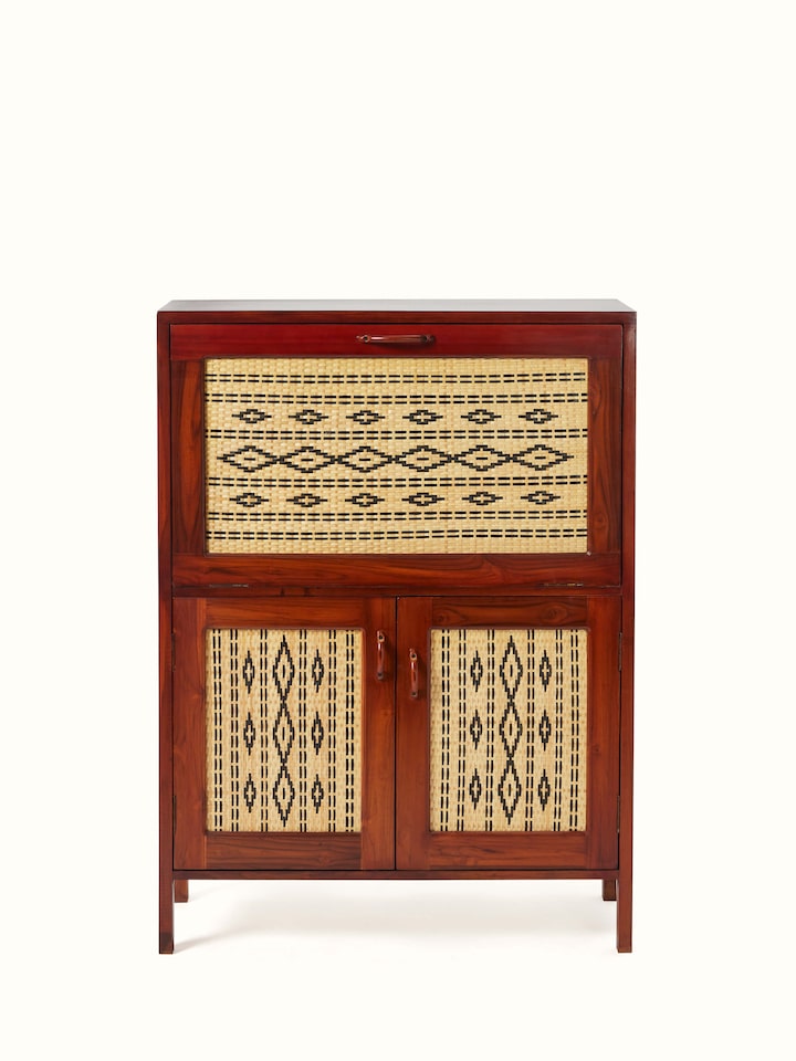 Front view of teak wood and cane bar cabinet, showcasing its elegant design and craftsmanship.