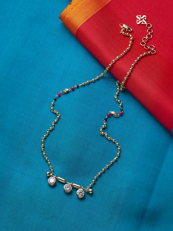 lifestyle view of open setting 14 karat gold mangalsutra