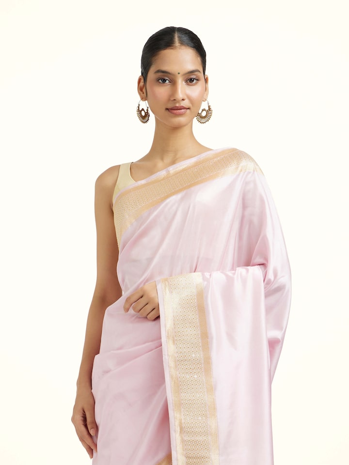 Angled view of the Cream Pink Mulberry Katan Silk Banarasi Saree