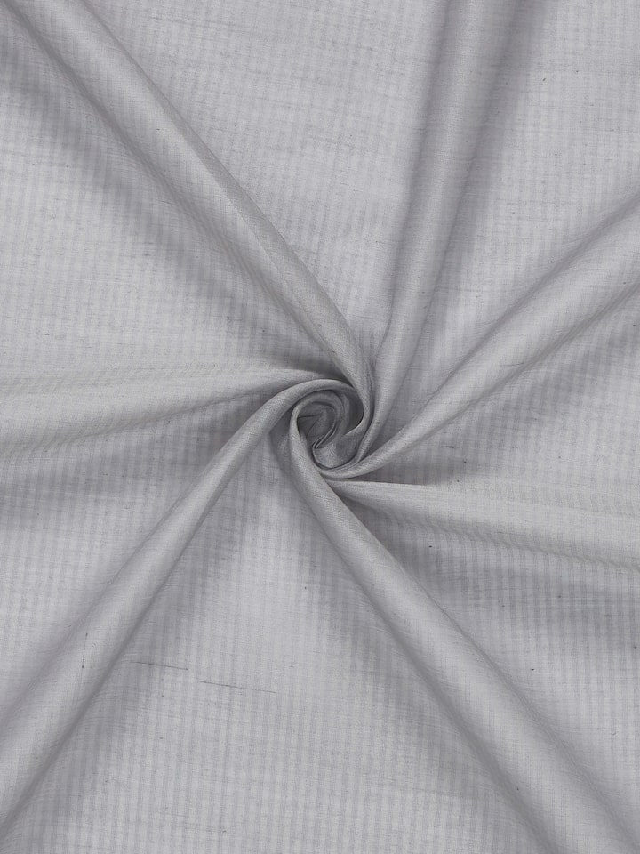 Angled view of Pragya Grey Curtain showing lightweight handloom fabric and sheen